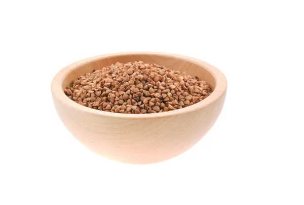 Buckwheat seeds in a wood bowl — Stock Photo, Image