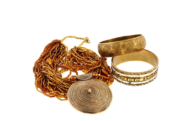 Two bronze bracelets and a necklace — Stock Photo, Image