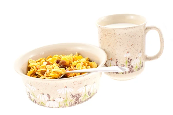 Cornflakes with milk in a cup — Stock Photo, Image