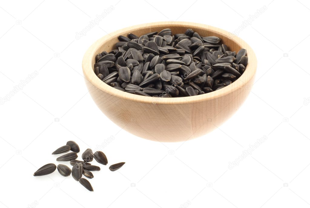 Sunflower seeds in a wood bowl