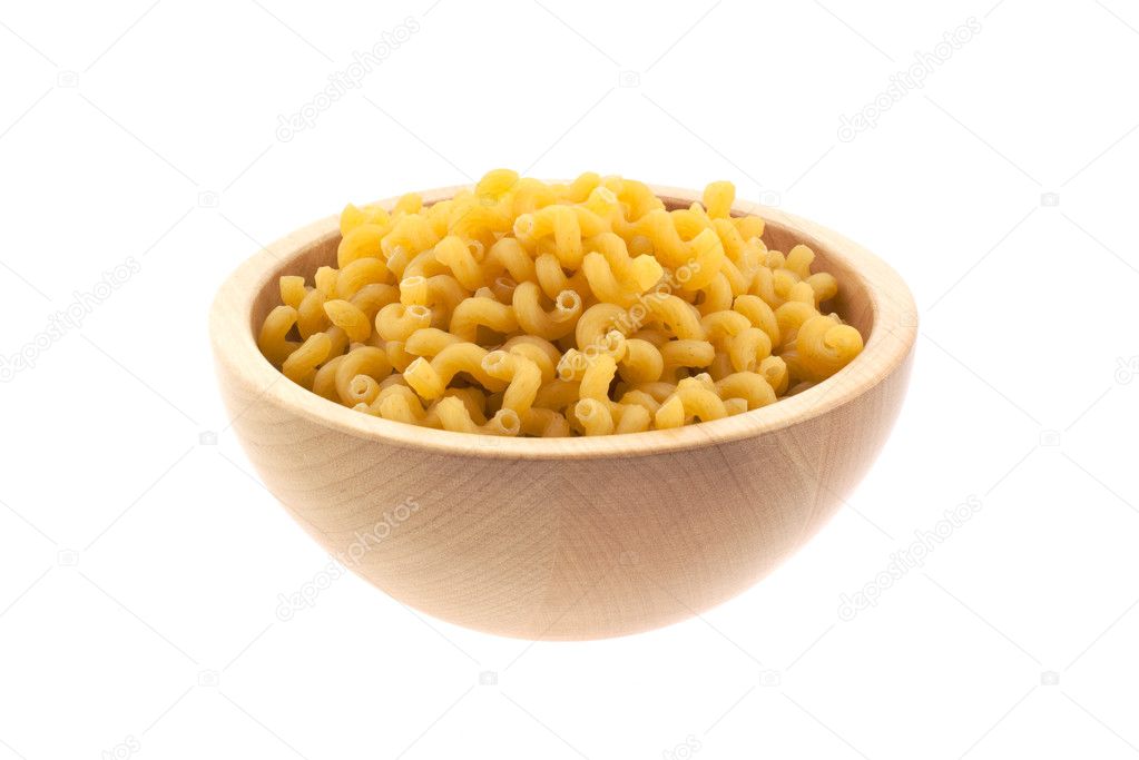Spiral pasta in a wood bowl