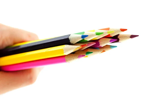 Crayons em uma mão no fundo branco — Fotografia de Stock