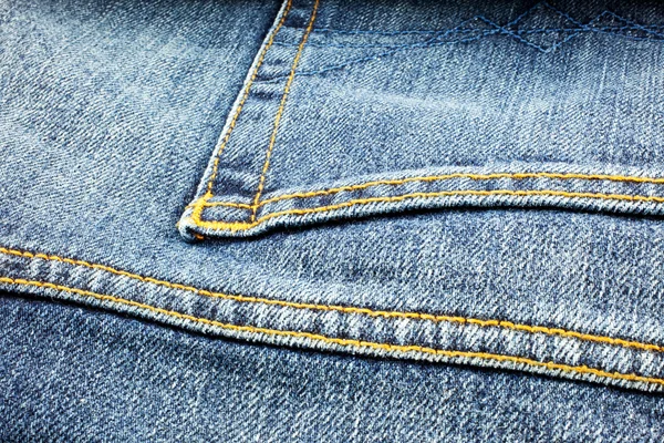 Jeans en denim bleu fond — Photo