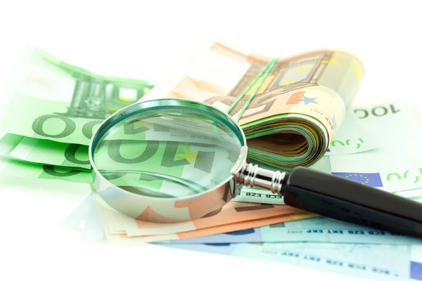 Euro notes with magnifier — Stock Photo, Image
