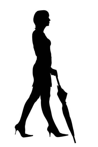 Şemsiye silueti ile yürüyen kadın — Stok fotoğraf