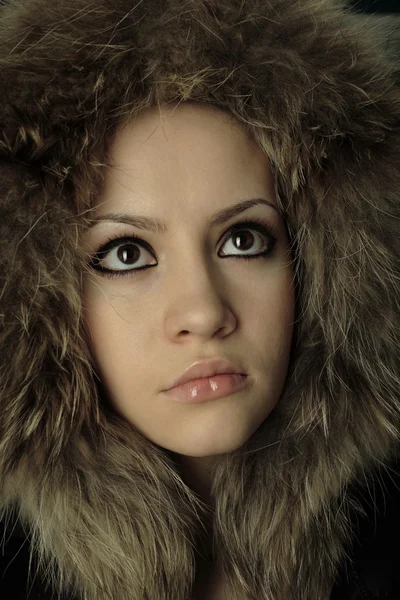 Young elegant girl with fur coat — Stock Photo, Image