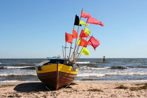 stock image Old fishing boat with flags