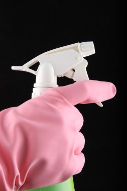 Hand using a spray bottle. clipart