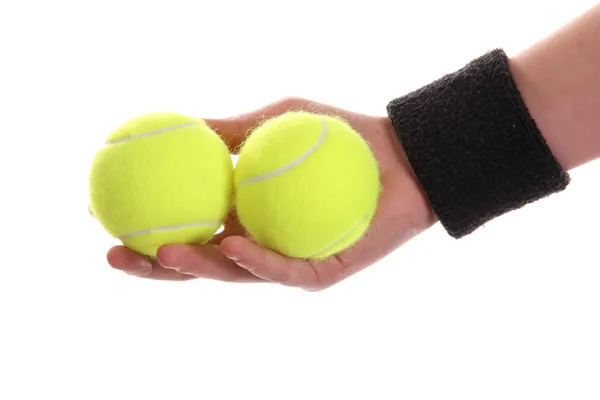 Mano sosteniendo pelota de tenis — Foto de Stock