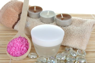 Cream and bath salt with towels and cand clipart