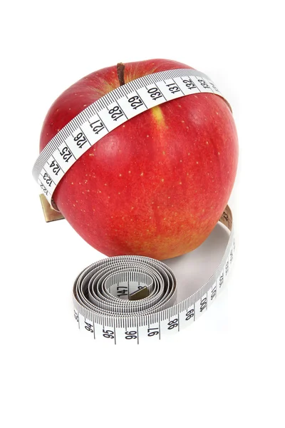 Apple and a measure tape — Stock Photo, Image