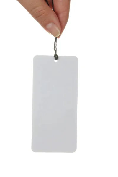 White paper tag and hand — Stock Photo, Image