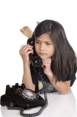 Girl talking on rotary phone, worried clipart