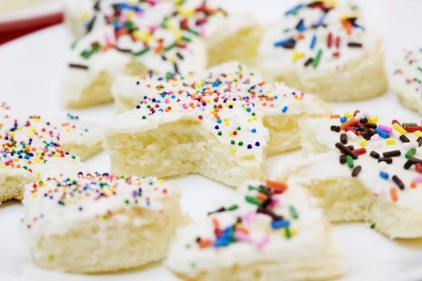 Frosted cake pieces with sprinkles — Stock Photo, Image
