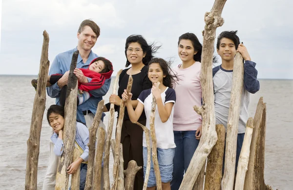 Biracial family together at the beach — Stock Photo, Image