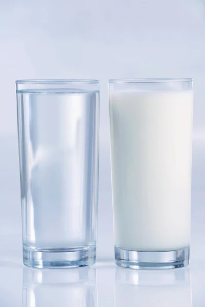 Glass of water and milk — Stock Photo, Image