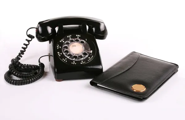 Old fashioned phone , notepad — Stock Photo, Image