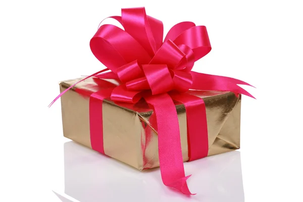 Gold present with pink ribbons — Stock Photo, Image