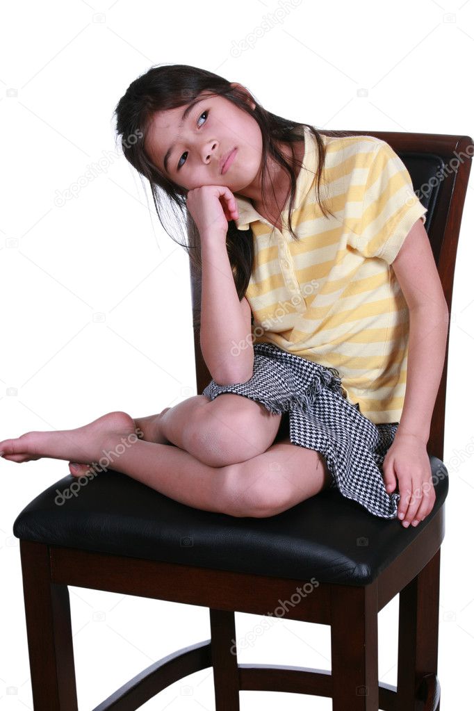 Sad girl sitting on chair