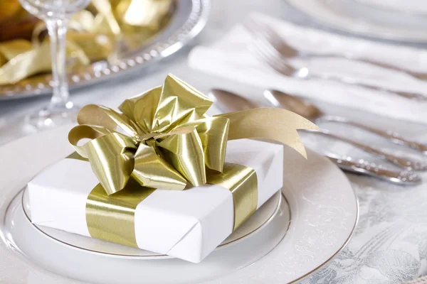 Elegant table set with present as focus — Stock Photo, Image