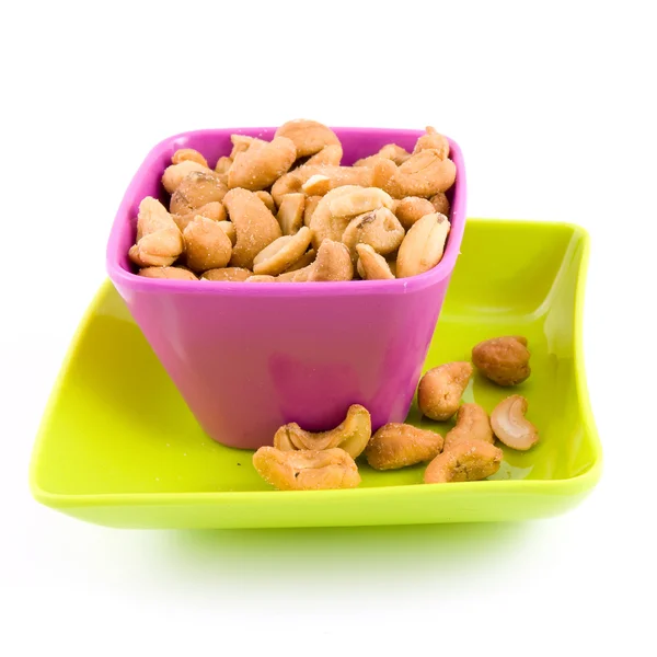 Färgade skål med cashewnötter Stockbild
