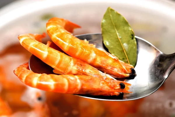 Three boiled prawns on a spoon — Stock Photo, Image