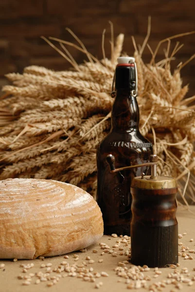 Bottle of beer and bread — Stock Photo, Image
