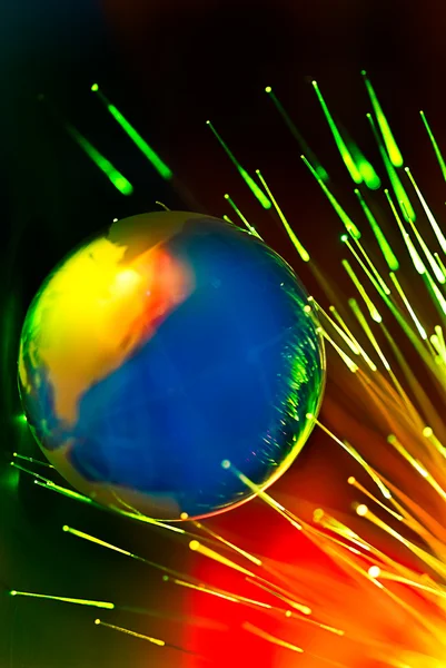 Fibers lights speeding around globe — Stock Photo, Image