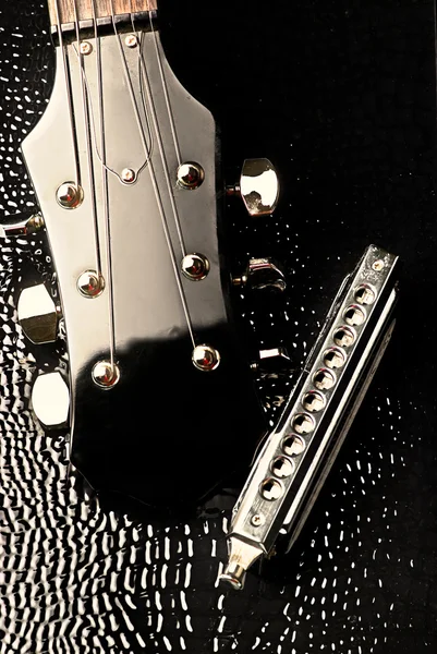 Cabeza de guitarra y harmon — Foto de Stock