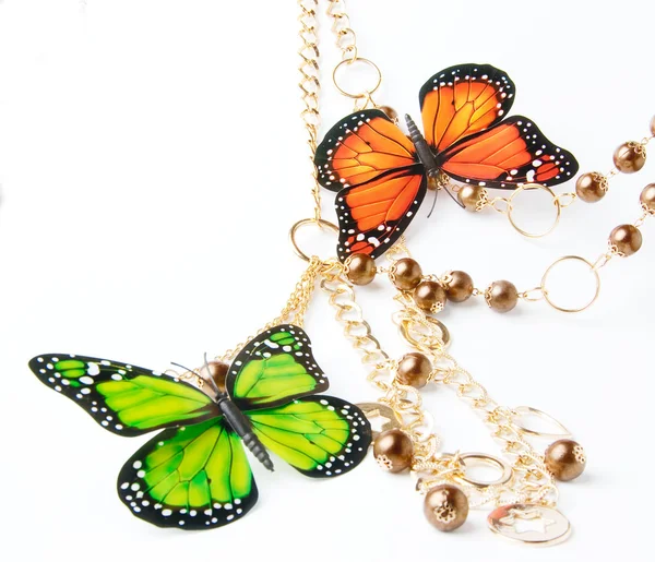 Perline dorate con farfalla — Foto Stock