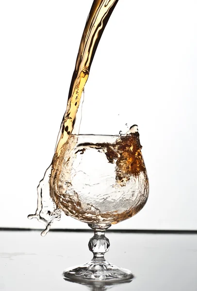 Brandy or whikey splashing — Stock Photo, Image