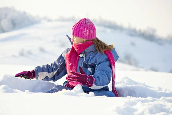 Happy child play at winter snow Stock Image