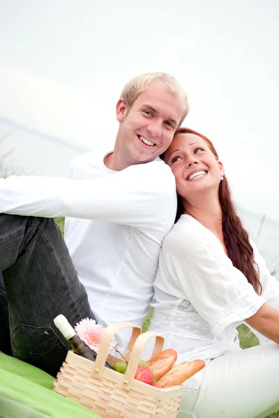 Cheerful man and woman on picnic — Stock Photo, Image