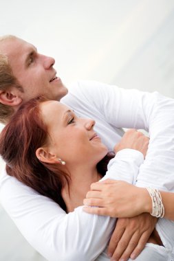 Loving couple holding each other clipart