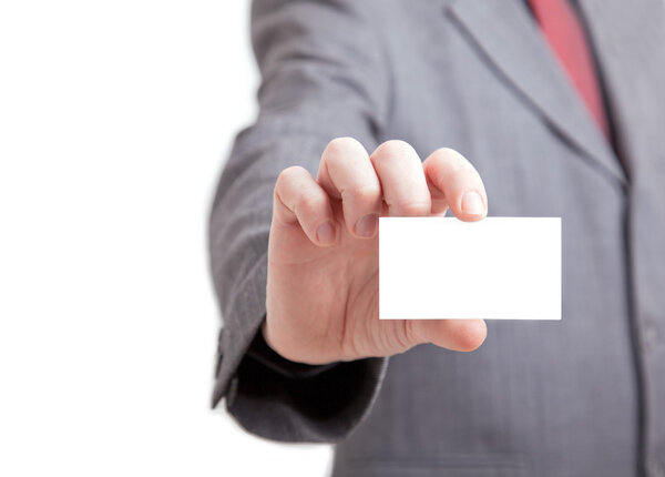 Businessman holding out a blank card