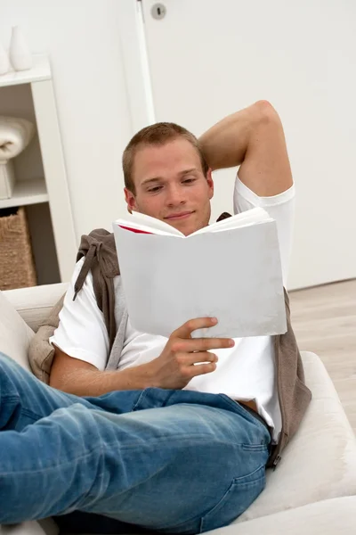 Man relaxing on the couch — Stock Photo, Image