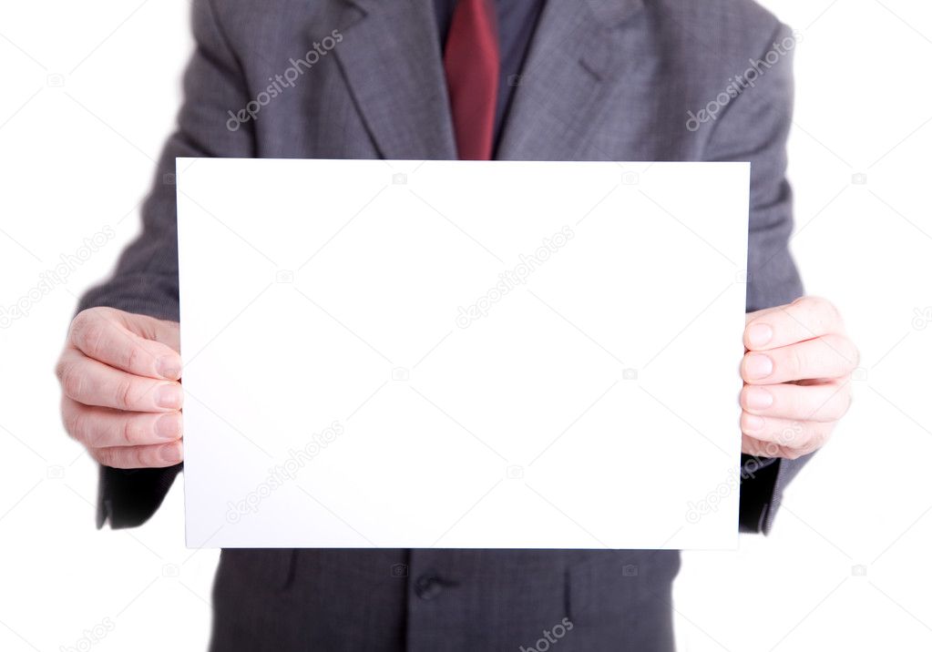 Man in suit holding out blank sign