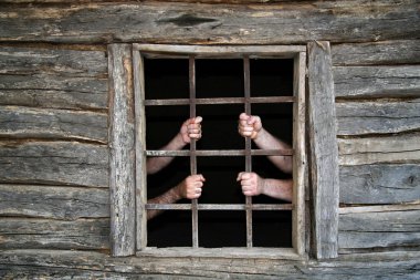 Hands behind prison bars clipart