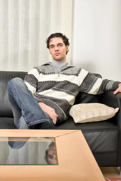 Man is sitting at home alone — Stock Photo, Image