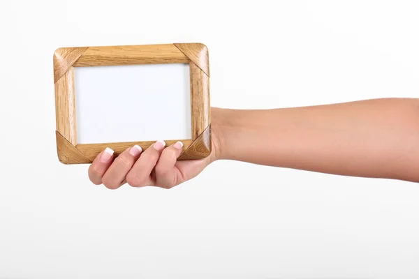 stock image Woman holding frame