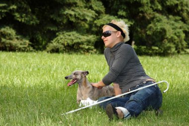 Blind woman with her litte dog clipart