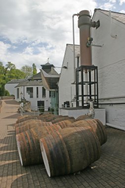 Whisky Barrels at Distillery in Scotland clipart