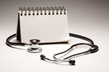 Blank Note Pad and Black Stethoscope clipart