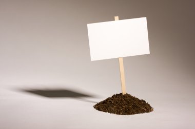 Blank White Sign in Dirt Pile clipart