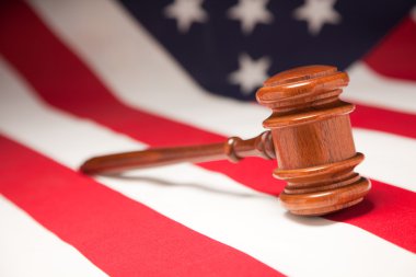 Gavel Resting on an American Flag clipart