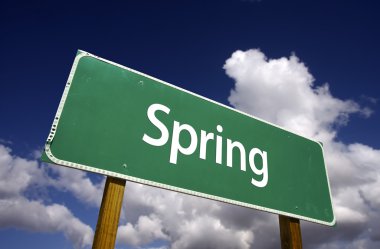 Spring Road Sign with Dramatic Clouds clipart