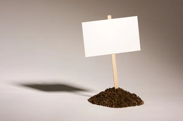 Blank White Sign in Dirt Pile — Stock Photo, Image