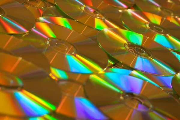 Dados dourados CDs ou DVDs Imagem de fundo — Fotografia de Stock
