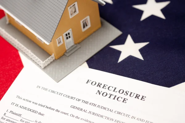 Foreclosure Notice and House on Flag — Stock Photo, Image