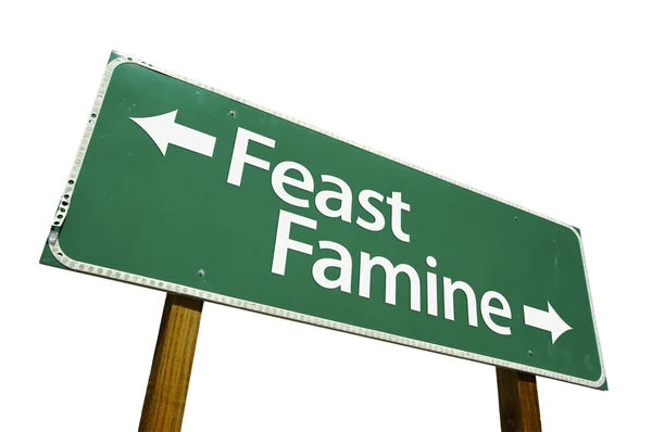 Feast Famine Green Road Sign on White — Stock Photo, Image